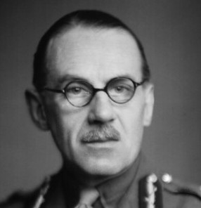 [Image: J. E. C. McCandlish in uniform, with glasses]